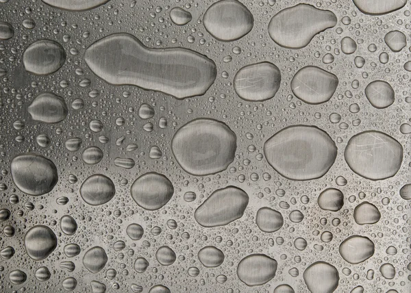 Waterdrops on brushed metal — Stock Photo, Image