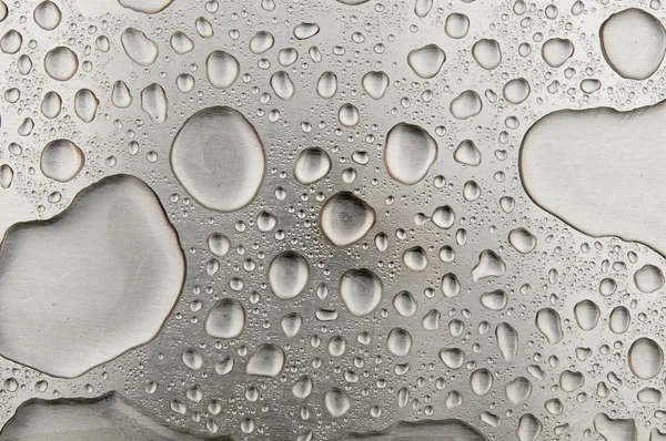 Waterdrops on brushed metal — Stock Photo, Image