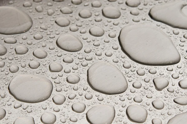 Gotas de agua sobre metal cepillado —  Fotos de Stock