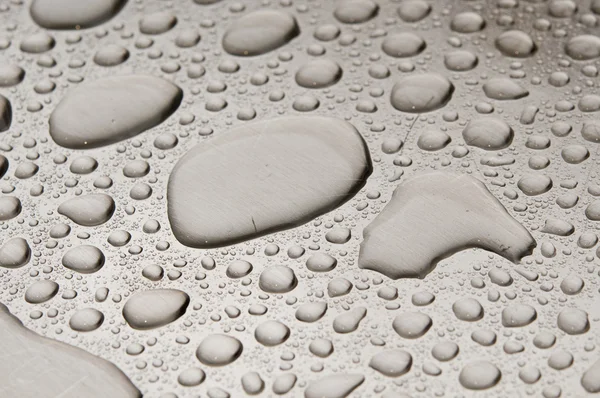 Gotas de agua sobre metal cepillado —  Fotos de Stock