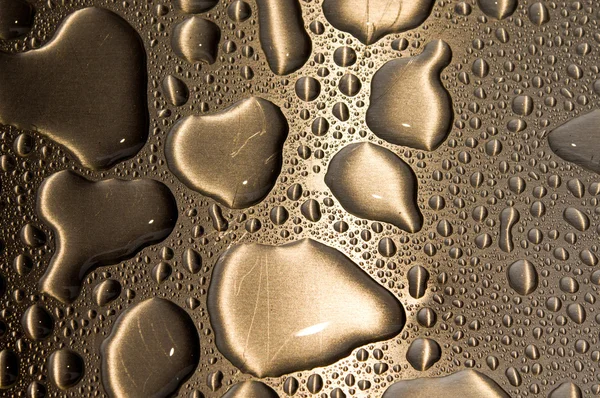 Waterdrops on brushed metal — Stock Photo, Image