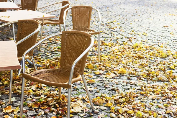 Empty open-air cafe in the autumn and text space