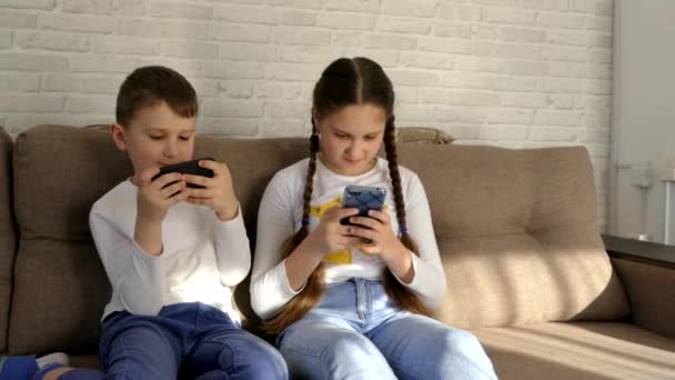 Children Play Gadgets Play Online Games Home Couch Parents Control — Stock Video