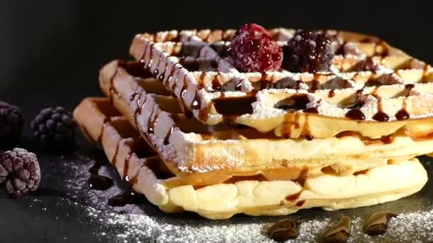 Baking waffles in a waffle iron. Sweet dessert made from dough and berries. — Stock Video