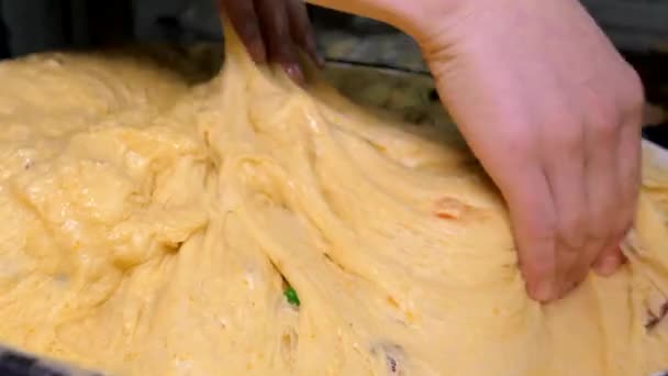 Kneading the dough. Knead the dough with your hands to bake baked goods. Making bread and Easter cake. Bun bakery. — Stock Video