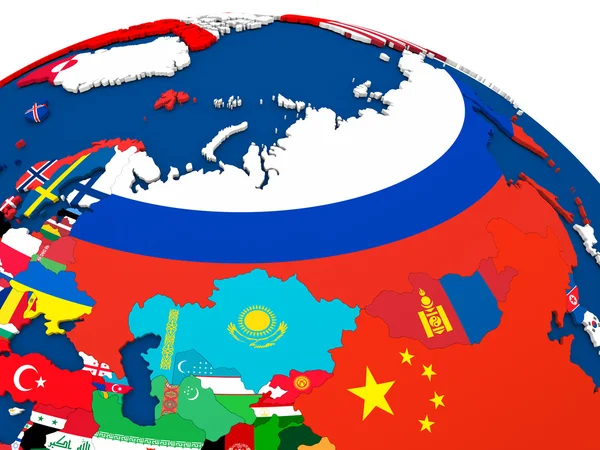 Rusland op wereldbol met vlaggen — Stockfoto