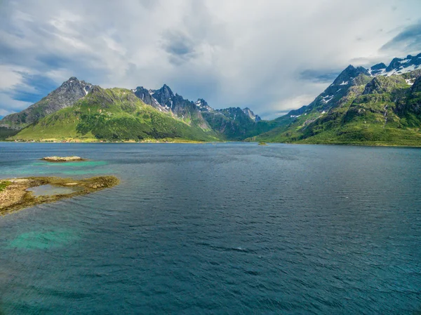 Mountain peaks around fjord — Stock Photo, Image