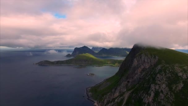 Flying in clouds by the cliffs on Lofoten islands, Norway — Stock Video