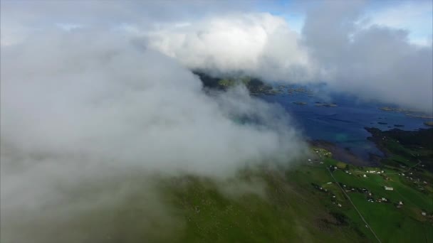 Aerial footage of clouds on green mountain top — Stock Video