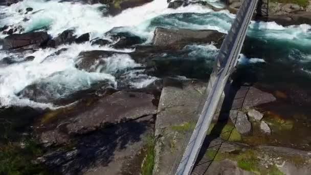 Aerial view of bridge above waterfall — Stock Video