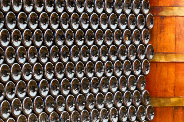 Wine cellar. Bottles of an old wine in dust and a web. — Stock Photo, Image