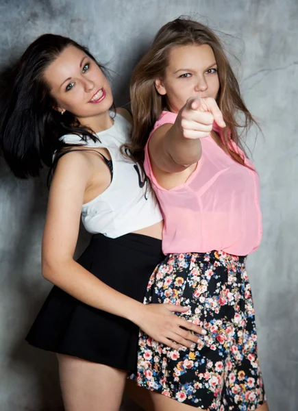 Two beautiful girls hugging each other — Stock Photo, Image