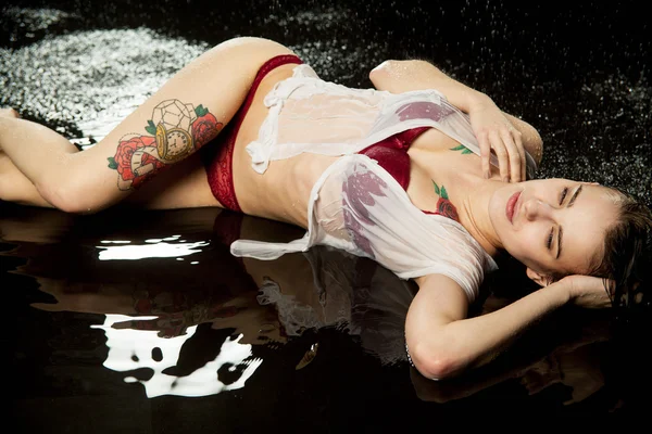 Portrait of a girl in wet shirt — Stock Photo, Image