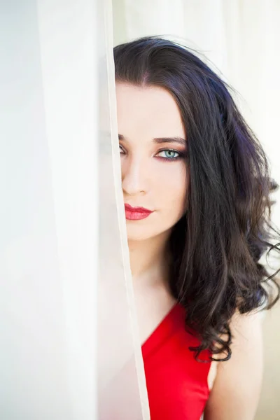 Young beautiful woman in red dress — Stock Photo, Image