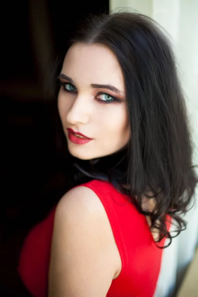 Young beautiful woman in red dress — Stock Photo, Image