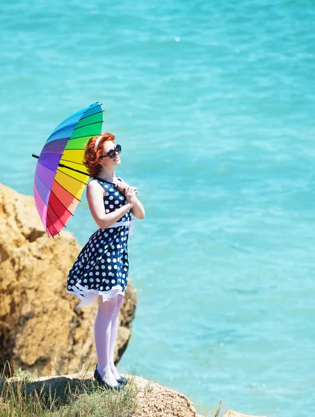 Girl with a colorful umbrella — Stock Photo, Image