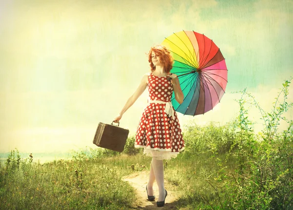 Retro girl with a colorful umbrella — Stock Photo, Image