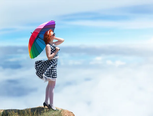 Girl with a colorful umbrella — Stock Photo, Image