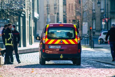 Reims France December 18, 2020 View of a red French fire truck in intervention in front of the Reims cathedral during the coronavirus pandemic affecting France and the lockdown of the country