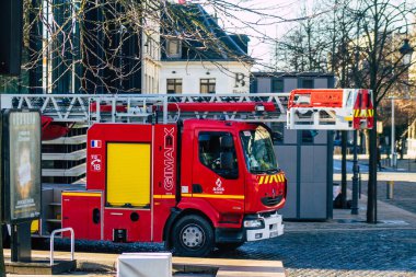 Reims France December 18, 2020 View of a red French fire truck in intervention in front of the Reims cathedral during the coronavirus pandemic affecting France and the lockdown of the country
