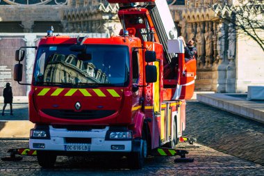 Reims France December 18, 2020 View of a red French fire truck in intervention in front of the Reims cathedral during the coronavirus pandemic affecting France and the lockdown of the country