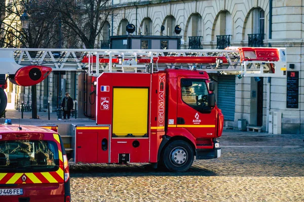 Reims France December 18, 2020 View of a red French fire truck in intervention in front of the Reims cathedral during the coronavirus pandemic affecting France and the lockdown of the country