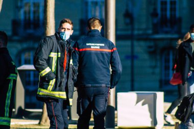 Reims France December 18, 2020 View of a traditional French fire fighter in intervention in front of the Reims cathedral during the coronavirus pandemic affecting France