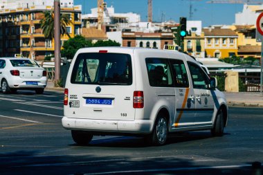 Seville Spain July 09, 2021 Taxi driving through the streets of Seville, an emblematic city and the capital of the region of Andalusia, in the south of Spain