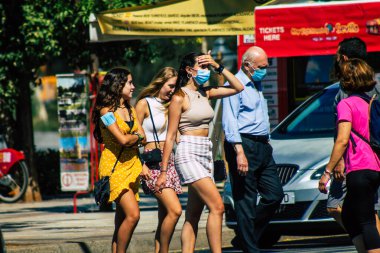 Seville Spain July 09, 2021 Pedestrians walking in the streets of Seville during the coronavirus outbreak hitting Spain, wearing a mask in the street is not mandatory