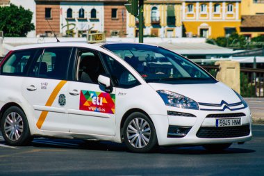Seville Spain July 09, 2021 Taxi driving through the streets of Seville, an emblematic city and the capital of the region of Andalusia, in the south of Spain