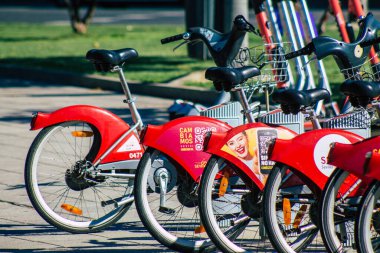 Seville Spain July 09, 2021 Accessible bicycles to hire for short periods of time, usually for a few hours parked in the street and part of the public transport system of Seville