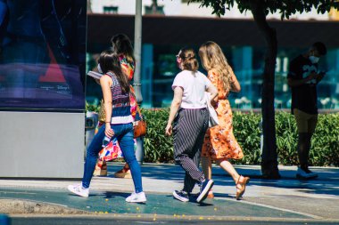Seville Spain July 09, 2021 Pedestrians walking in the streets of Seville during the coronavirus outbreak hitting Spain, wearing a mask in the street is not mandatory