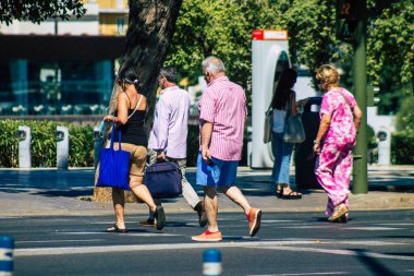 Seville Spain July 09, 2021 Pedestrians walking in the streets of Seville during the coronavirus outbreak hitting Spain, wearing a mask in the street is not mandatory
