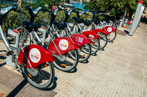 stock image Seville Spain September 04, 2021 Accessible bicycles to hire for short periods of time, usually for a few hours parked in the street and part of the public transport system of Seville