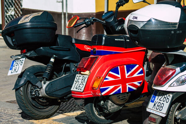 Seville Spain September 18, 2021 Motorcycles parked in the streets of Seville, an emblematic city and the capital of the region of Andalusia, in the south of Spain