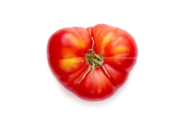 Tomato in the shape of heart on white background — Stock Photo, Image