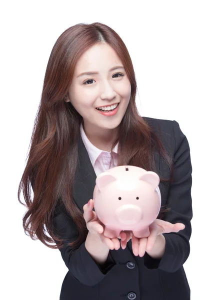 Business woman holding pink piggy — стоковое фото