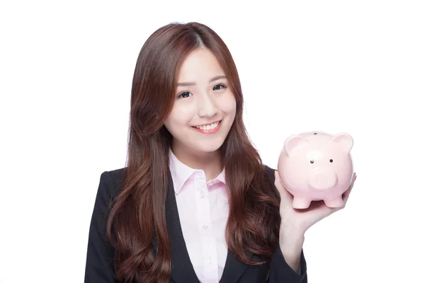 Business woman holding pink piggy — стоковое фото