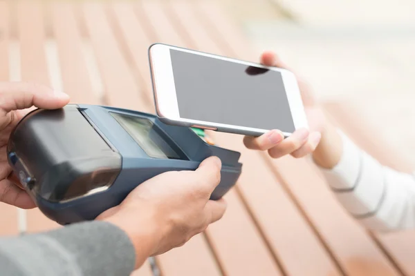 Customer paying  by cellphone — Stock Photo, Image