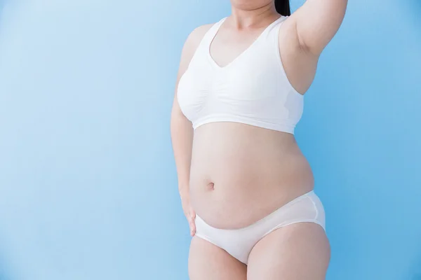 Lihava ylipainoinen nainen — kuvapankkivalokuva