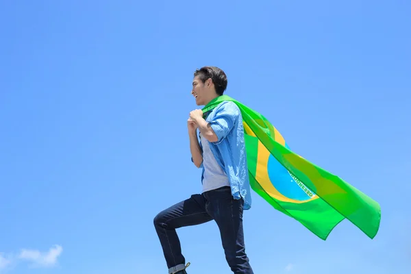 Hombre sosteniendo bandera brasileña — Foto de Stock