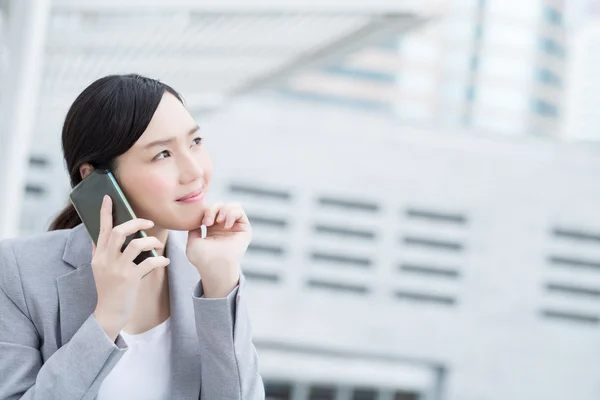 Business woman speak smart phone — Stock Photo, Image
