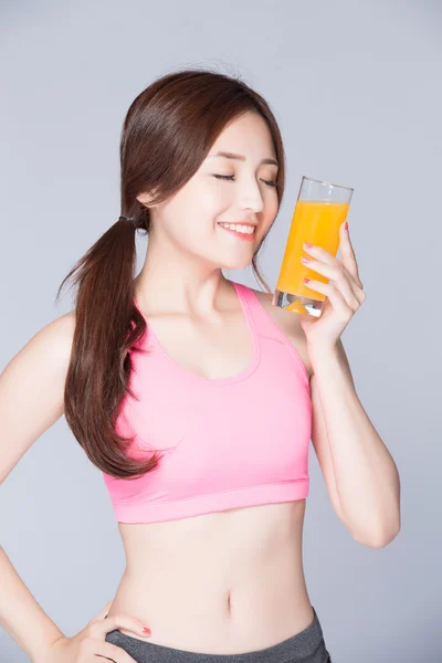 Woman holding  orange juice — Stock Photo, Image