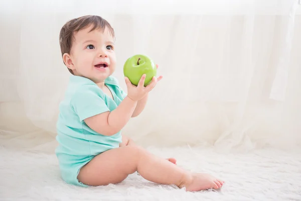 Boy taking   green apple — Stock Photo, Image
