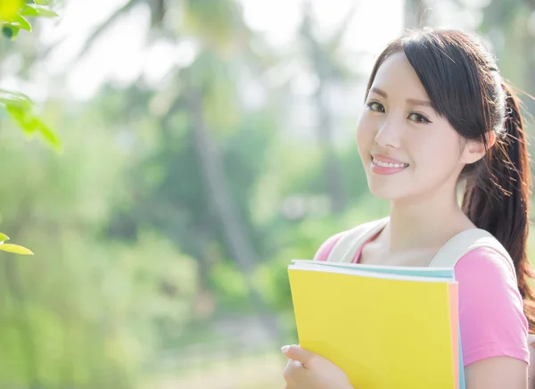 Student holding books — Stock Photo, Image