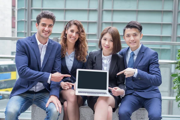 Businesspeople  showing  laptop — Stock Photo, Image