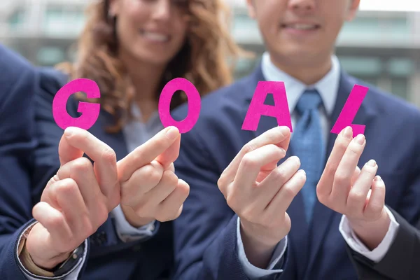 Businesspeople  showing  goal text — Stock Photo, Image