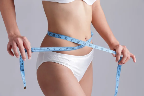 Woman measuring  waist — Stock Photo, Image