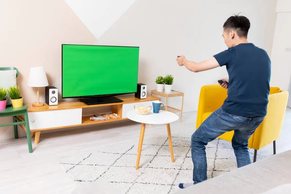 Asian Young Man Playing Winning Motion Sensing Game Green Chroma — Stock Photo, Image