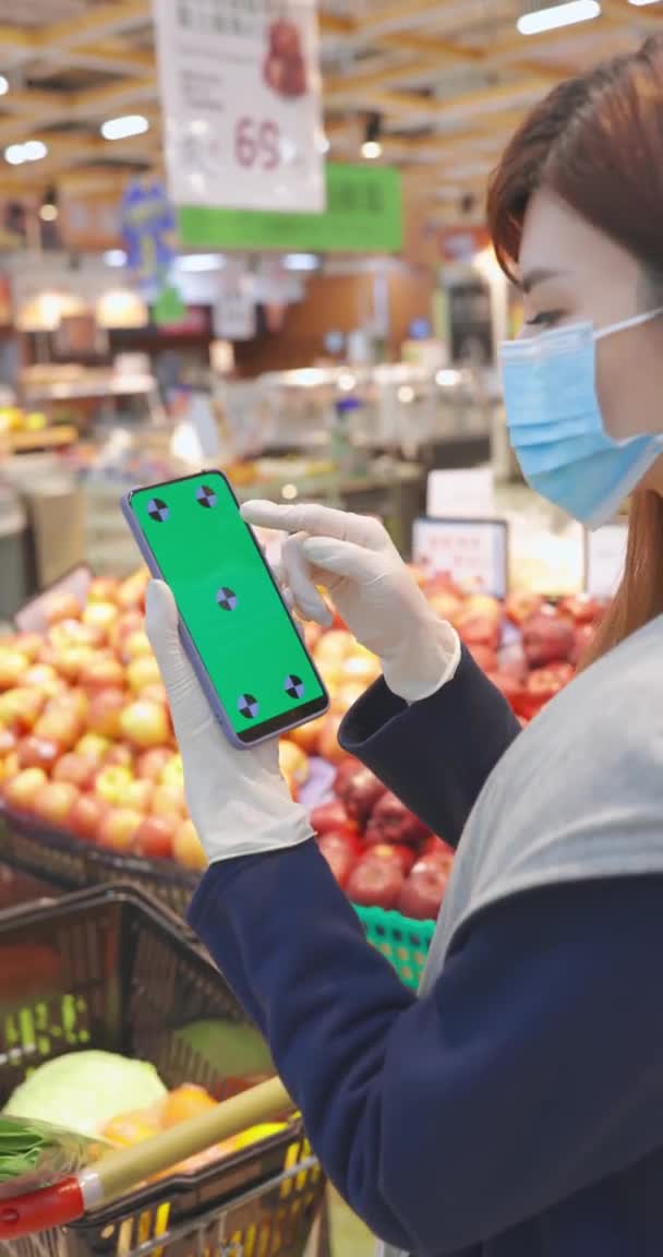 Green-Screen-Smartphone im Geschäft — Stockvideo
